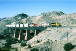 AT&SF, Santa Fe SD40-2 5075 leads 330-153-202 with an eastbound over bridge #1, into Abo Canyon, Sais, New Mexico. April 14, 1997. 